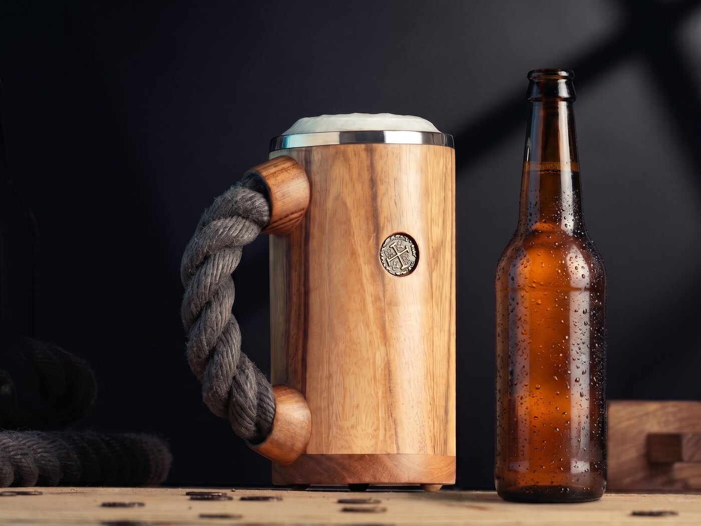 A CHUUG with a foam crown next to an open amber beer bottle dripping with condensation
